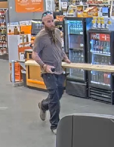 photo of male theft suspect at checkout