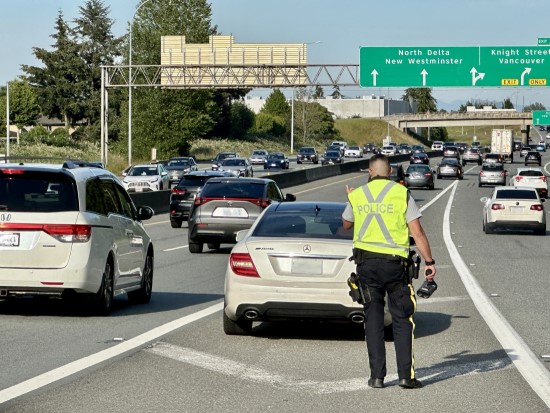 Richmond RCMP officer conducting traffic enforcement in Highway 91