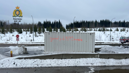 Photo of the graffiti on the sea-can that reads <q>good job McCreadie</q>