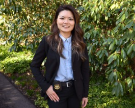 photo of Sgt. Freda Fong outdoors in a suit