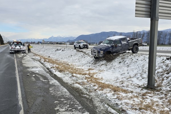 BC Highway Patrol stopped with a 4x4 pickup truck that spun out in the snow on Highway #1 near Chilliwack due to a missing wheel