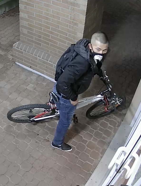 Man in black jacket on a bike