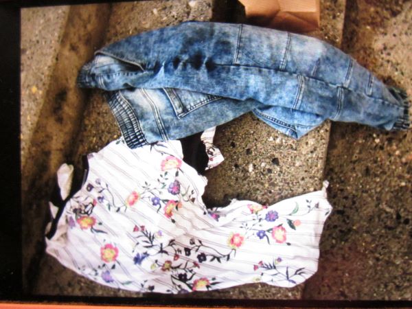 Photo of a white floral shirt and jeans the suspect changed into following the robbery. 