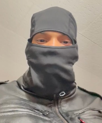 Image used in blackmail attempt showing a person in a grey ski mask
