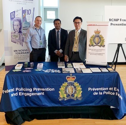 From left to right: Mr. Farid Salji of the Bank of Canada, Sgt. Raju Mitra, and Cpl. Vinh Ngo of BC RCMP FPPE, at UBC.