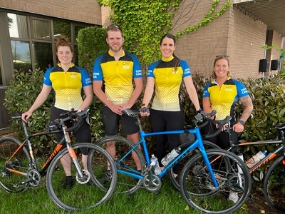 Upper Fraser Valley Regional Detachment riders in cycling gear with bikes