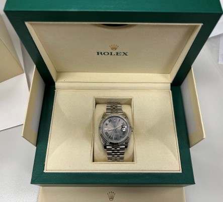 An image of a counterfeit Rolex in a box
