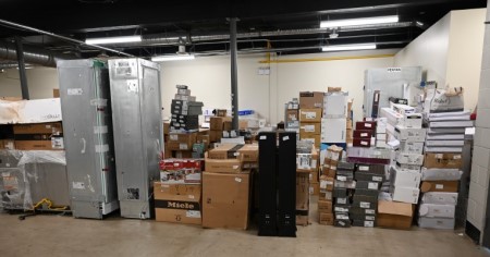 Large and small boxes and appliances inside a room