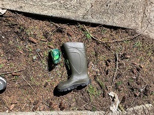 Close up photo of a green boot