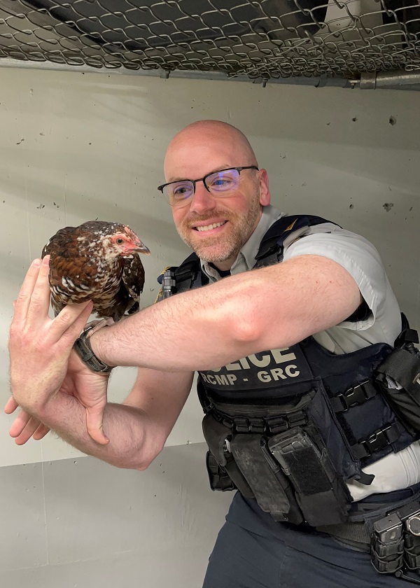 Corporal Justin Bauer holding the chicken