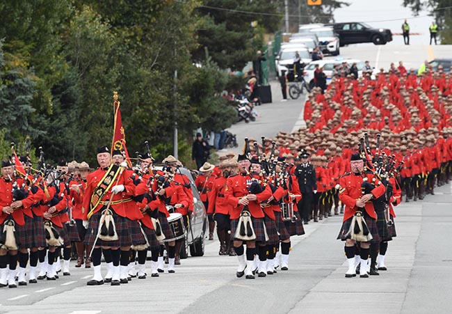 Members marching in red serge