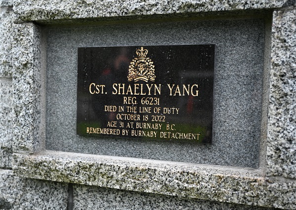 Cst. Shaelyn Yang’s name on a black plaque on a stone cairn outdoors