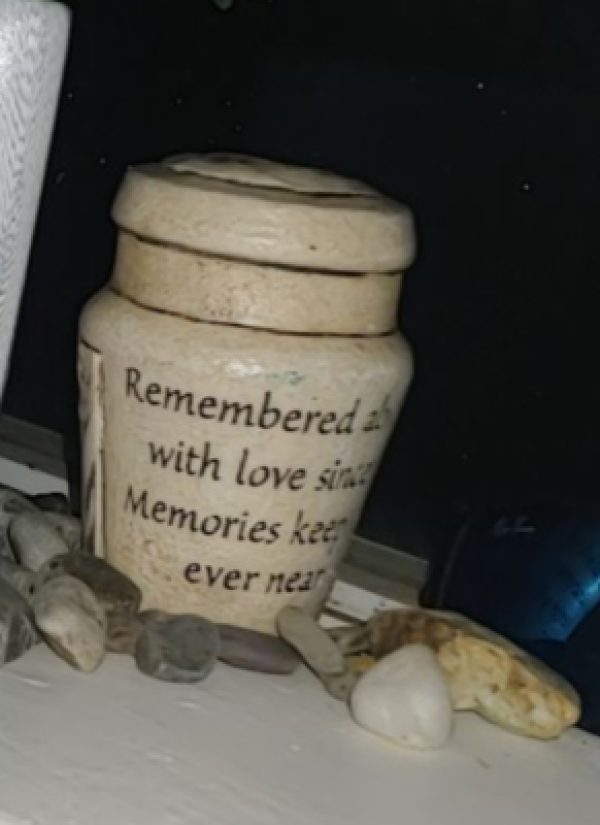 White Urn with message on side