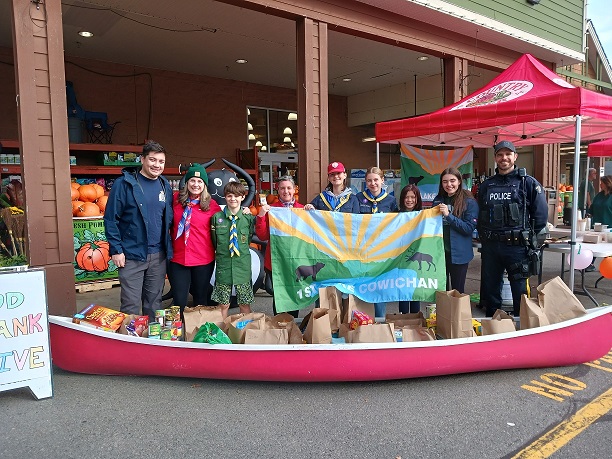 Scouts and RCMP members with Scout canoe