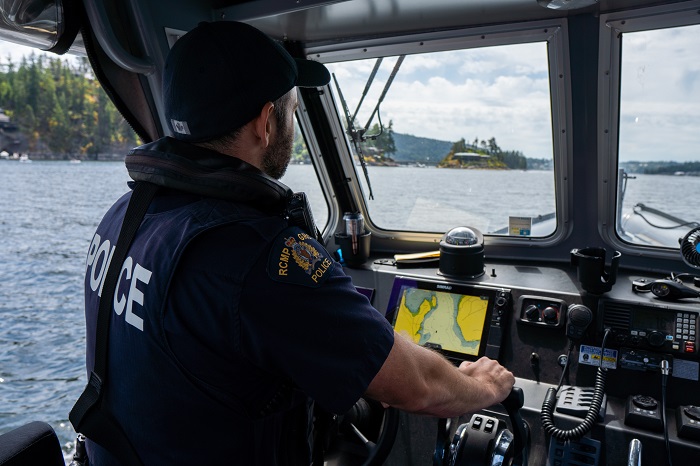 Rural officer patrolling on police boat