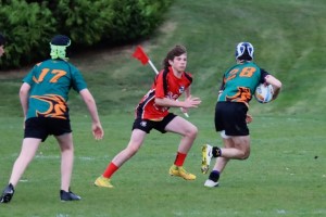 Teenage male playing rugby