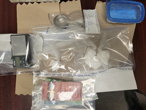 Suspected cocaine, Canadian cash and drug paraphernalia