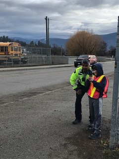 photo of officer and child with radar gun